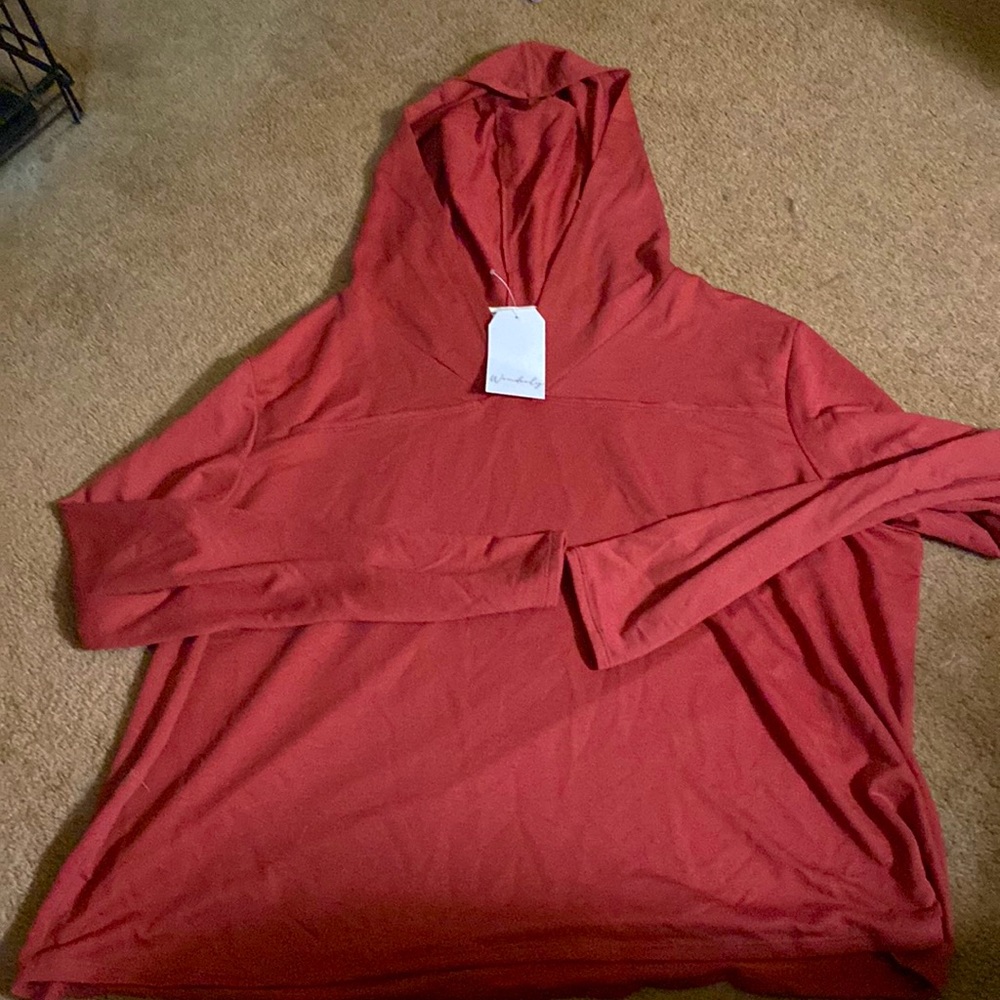 Hoodie/T-shirt material. It’s basically a hooded T-shirt comfortable dark pink